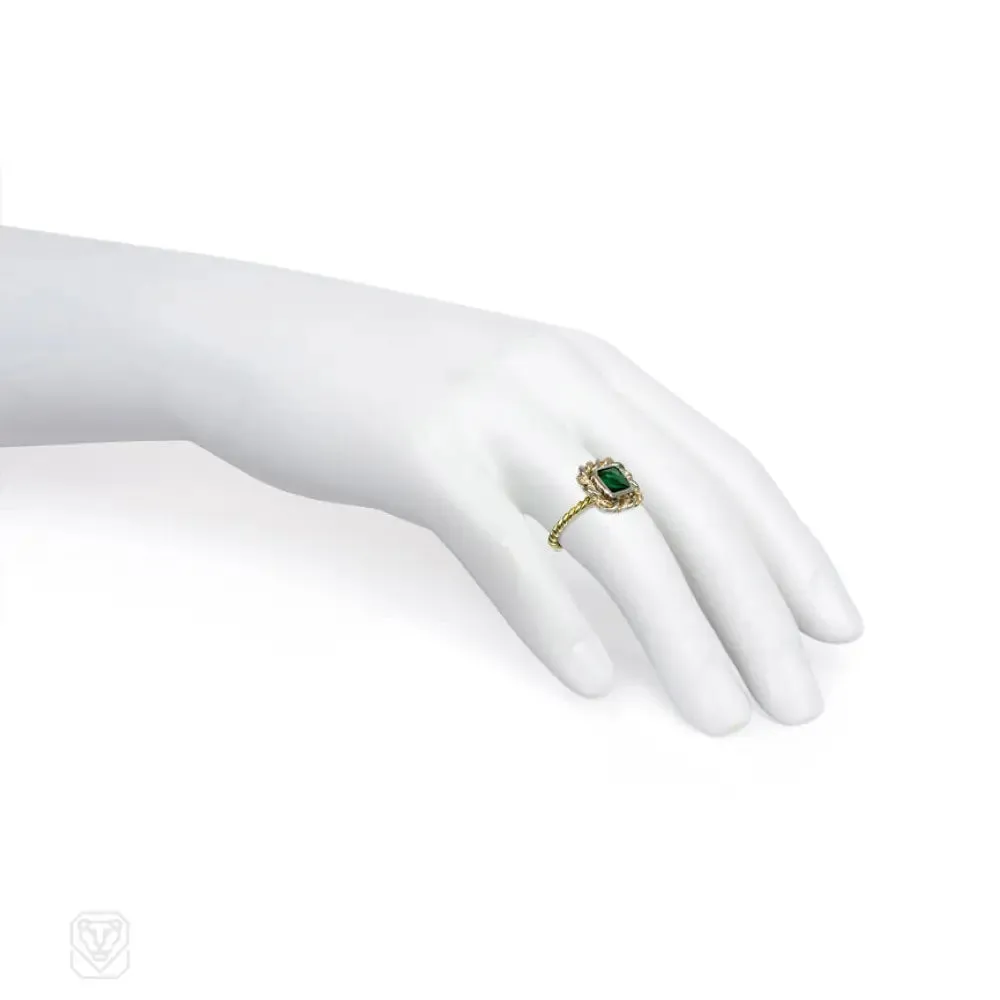 Emerald and mixed metal ring