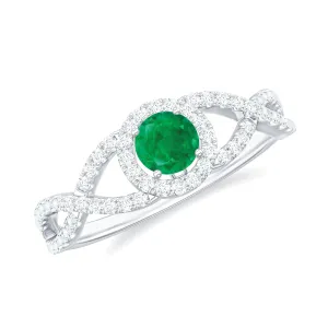 Round Emerald Crisscross Engagement Ring with Diamond Halo